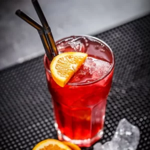 Berry Deadly cocktail served in a Collins Glass