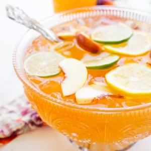 Spiced Peach Punch cocktail served in a Collins Glass