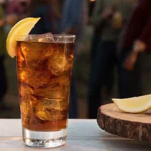 Citrus Coke cocktail served in a Highball Glass
